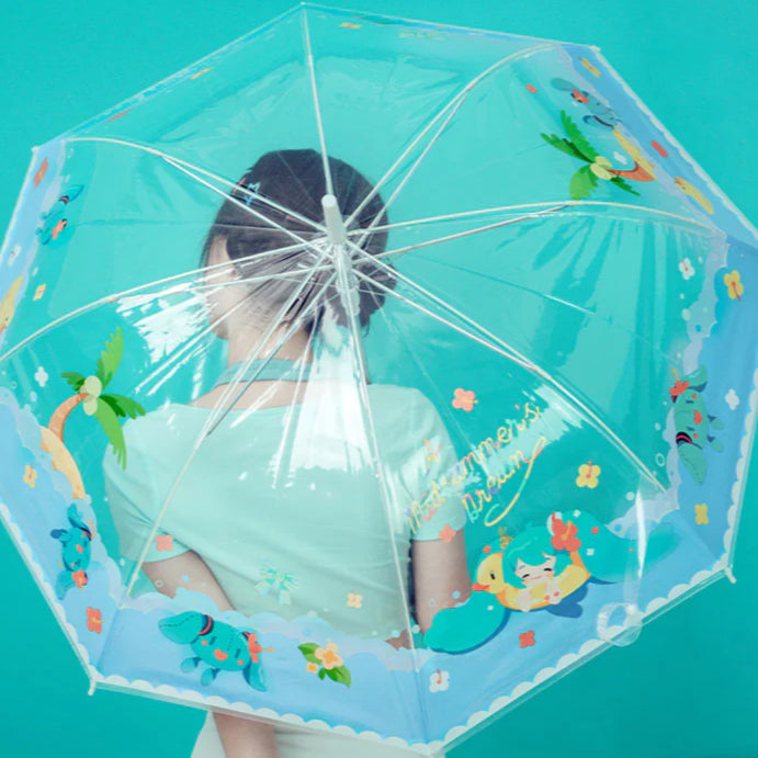 Girl under clear umbrella with colorful Hatsune Miku beach-themed design on a teal background