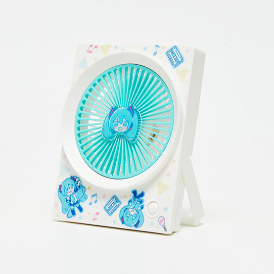 Cute Hatsune Miku portable desk fan with chibi Miku face in the center and playful designs on the frame