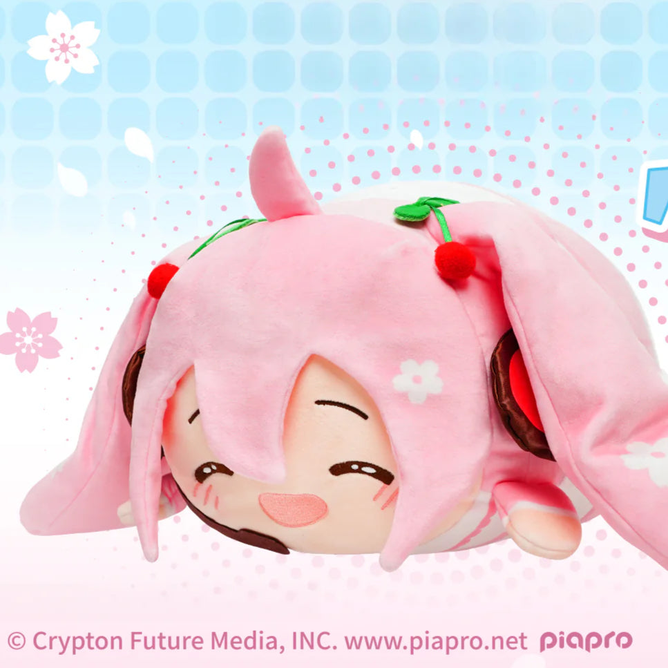 Sakura Miku plush in lying pose with cherry hair ornaments and pink outfit, smiling sweetly
