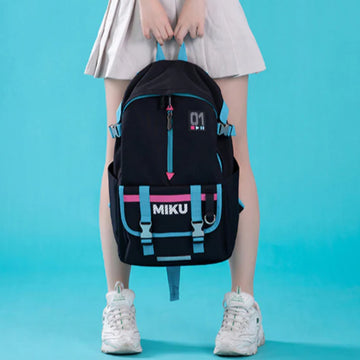 Girl holding Hatsune Miku backpack with “MIKU” logo and cyan-pink straps