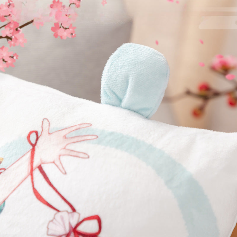 Close-up of Hatsune Miku plush pillow, showing the cute bunny ear decoration on the corner