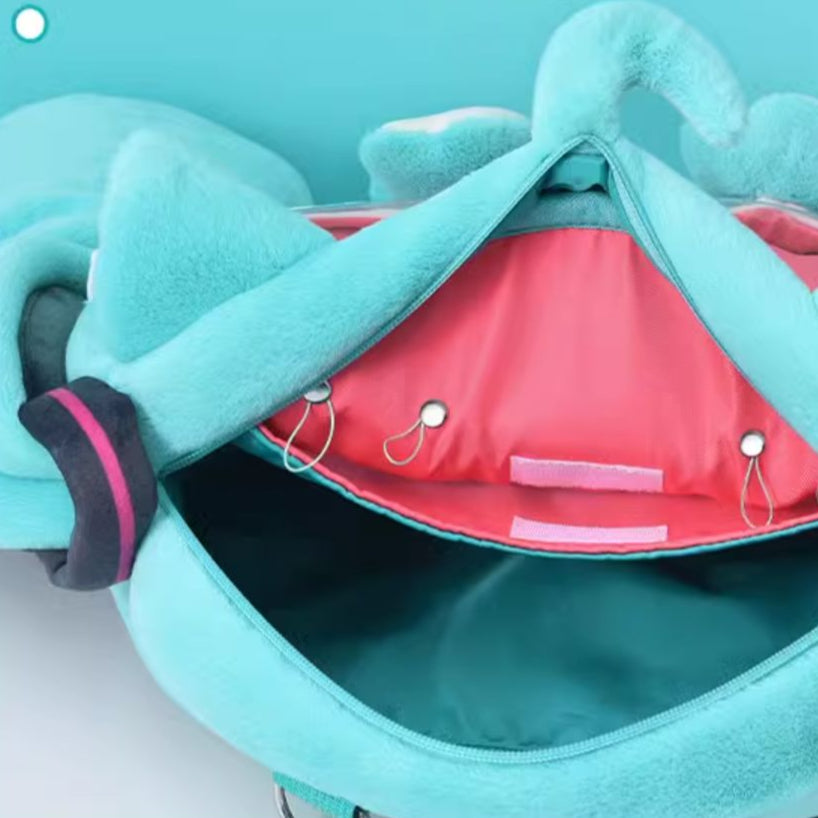 Inside view of plush Miku cat backpack showing pink lining and elastic loops