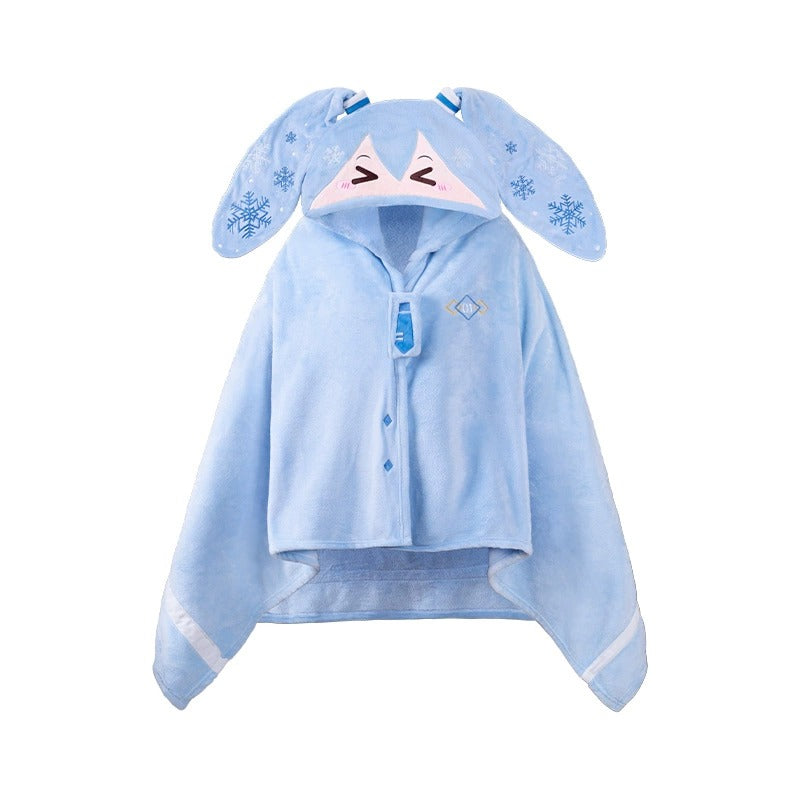 Hatsune Miku plush cape with bunny ears, snowflake details, and cute smiling face on hood