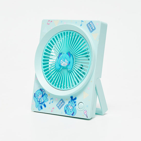 Cute Hatsune Miku portable desk fan with chibi Miku face in the center and playful designs on the frame
