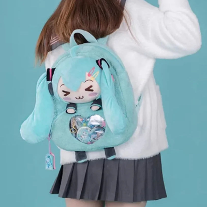 Girl carrying a plush turquoise Hatsune Miku backpack with ita bag window