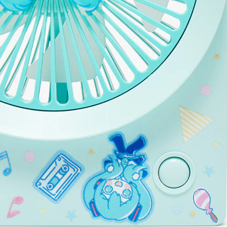 Close-up of the fan base with upside-down chibi Miku illustration and colorful retro icons