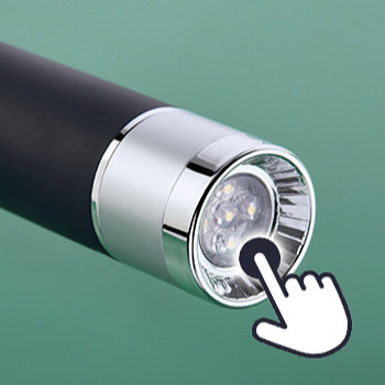 Close-up of LED flashlight switch on umbrella handle.