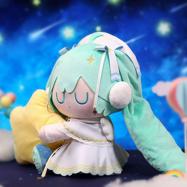 Hatsune Miku plush in starry angel outfit hugging a yellow star pillow, dreamy night sky background