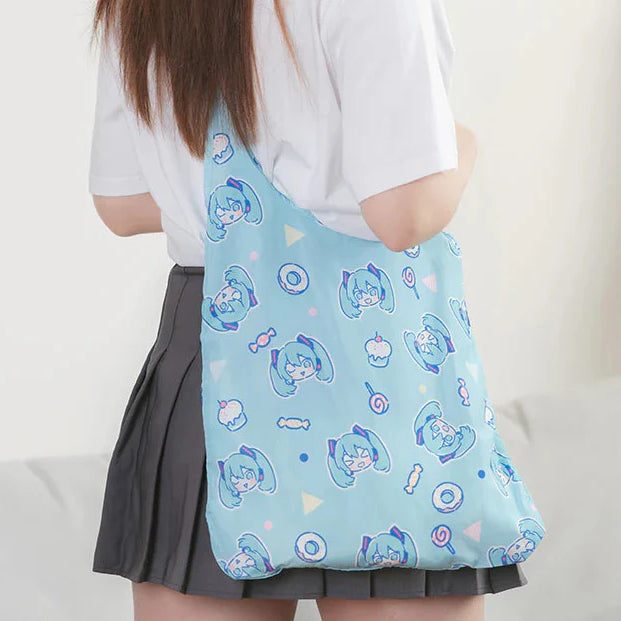 Girl wearing a cute pastel tote bag printed with Hatsune Miku faces and sweets