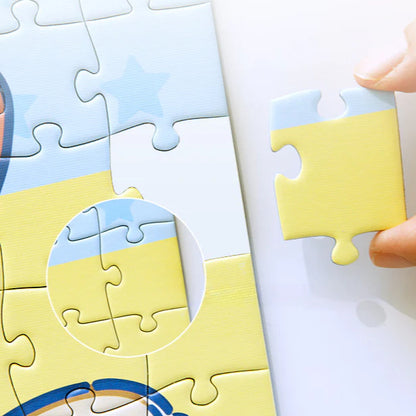Close-up of a hand placing a yellow puzzle piece into place, with zoomed-in alignment detail.