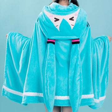 Hatsune Miku plush cape worn, featuring bunny ears on the hood and a flowing, oversized design